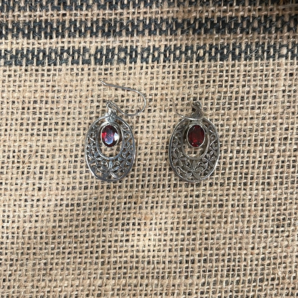 Sterling silver dangle earrings.
